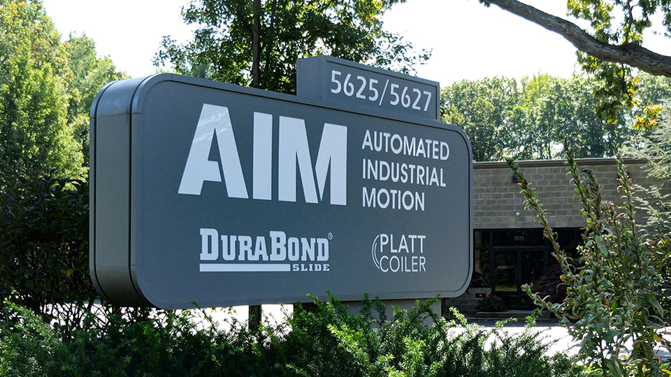 Company sign for Automated Industrial Motion (AIM), DuraBond Slide and Platt Coiler)